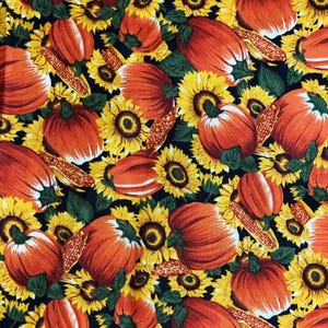May include: A black background with a repeating pattern of orange pumpkins, yellow sunflowers, and green leaves.