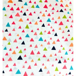 May include: White fabric with a scattered pattern of colorful triangles. The triangles are in shades of red, pink, orange, green, blue, and black. The fabric is likely cotton or a similar material.