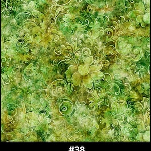 May include: A fabric with a green floral pattern. The design features various shades of green, with lighter green floral elements and swirling patterns on a darker green background. The text at the bottom reads "#38 Green".