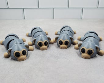 3D Printed Articulating Silver Robot Monkeys