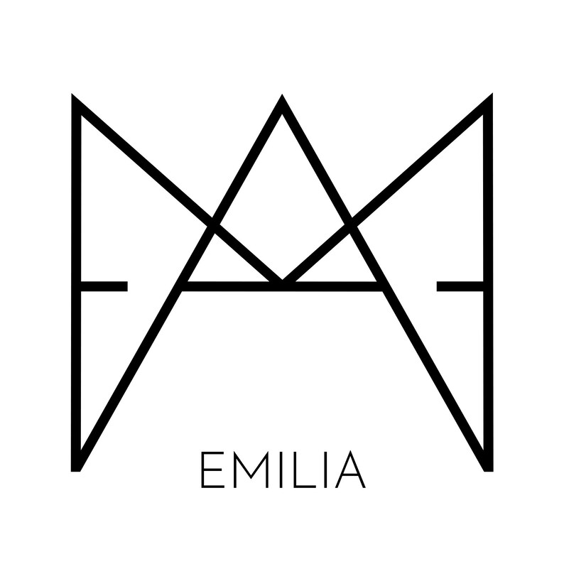 May include: Black and white geometric design with the word "EMILIA" underneath.