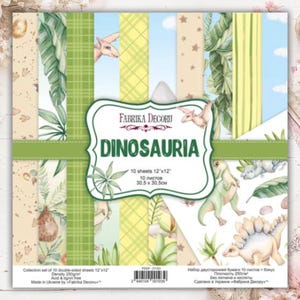 May include: A set of 10 double-sided scrapbook paper sheets measuring 12x12 inches, titled Dinosauria by Fabrika Decoru. The paper features various patterns including green plaid, tropical leaves, stars, and illustrations of dinosaurs.