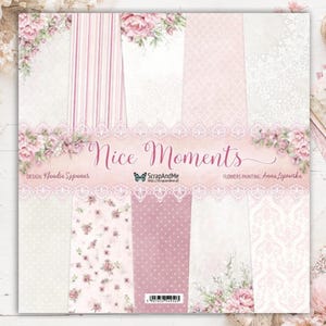 May include: A square paper pad titled Nice Moments featuring a collection of vertical panels with soft pink and white patterns, including stripes, polka dots, damask, and floral motifs, accented by a decorative lace border and butterfly logo.