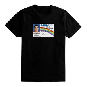 May include: Black t-shirt featuring a white graphic of a Hawaii driver's licence with a man's surprised expression. The licence number is 91-47-87461 and the name is 'Derek Zoolander'.