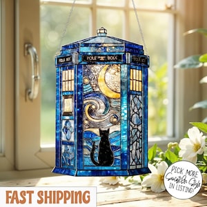 May include: A blue stained glass police box-shaped lantern, featuring a black cat, a crescent moon, and a starry night design. The lantern is suspended by a chain. The words 'POLE BOX' are visible.