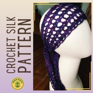 May include: A purple and blue crochet headband with a tied end. The headband is on a white mannequin head. The text "CROCHET SILK PATTERN" is on the left side of the image.
