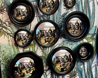 Armações pretas convexas, profundas e arredondadas.