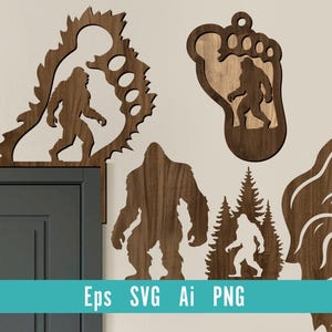 May include: Wooden Bigfoot-themed wall art pieces in various shapes. The designs include a Bigfoot silhouette, a footprint, and a forest scene. The art is made of brown wood and is mounted on a light-coloured wall.