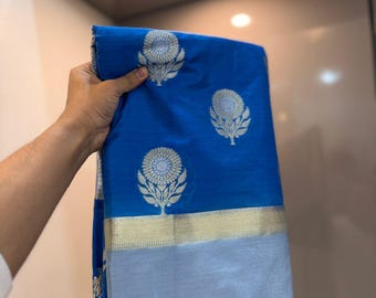 Elegante sari de seda Banarasi con bordado zari para ocasiones festivas.