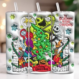 May include: White tumbler featuring characters from The Nightmare Before Christmas, including Jack Skellington, Sally, and Oogie Boogie. The design includes a Christmas tree, gifts, and the text "Merry Christmas". The tumbler has a straw and snowflake accents.