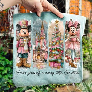 May include: A light blue Christmas-themed graphic featuring Mickey Mouse as a toy soldier, a pink castle, a decorated Christmas tree, and Minnie Mouse in a pink tutu. The text "Have yourself a merry little Christmas" is at the bottom.