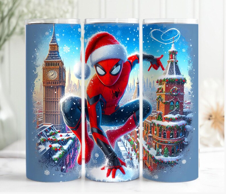 May include: A blue tumbler featuring a festive Spider-Man in a Santa hat, set against a snowy London backdrop with Big Ben and decorated buildings. The design is a vibrant illustration with a winter holiday theme.