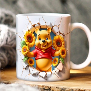 May include: White ceramic mug with a Winnie the Pooh character design. Pooh Bear is peeking out of a cracked wall with sunflowers surrounding him.