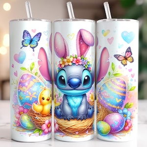 May include: A white tumbler with a colorful Easter design featuring Stitch from Lilo & Stitch dressed as an Easter bunny. The design includes pastel pink, blue, yellow, and green colors with hearts, butterflies, and Easter eggs.