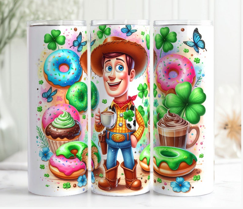 May include: A white tumbler with a green, pink, and brown design. The design features a cartoon character of Woody from Toy Story wearing a green vest and holding a cup of coffee. The design also includes donuts, shamrocks, and cupcakes.