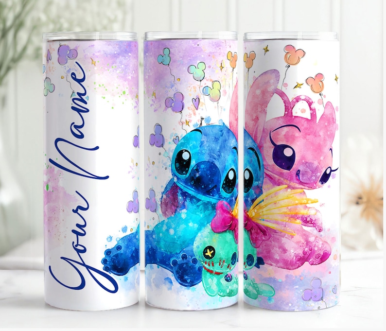 May include: Three stainless steel tumblers with a watercolor design featuring Stitch and Angel from the Disney movie Lilo & Stitch. The tumblers have a white background with pastel pink, blue, and purple watercolor accents. One tumbler has the text "Your Name" in blue cursive writing.