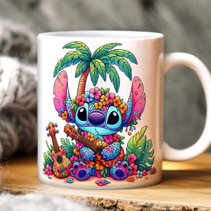 May include: A white ceramic mug with a colorful illustration of Stitch from Lilo & Stitch playing a ukulele. Stitch is wearing a flower lei and surrounded by tropical plants and flowers. The mug has a handle on the right side.