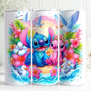 May include: A set of three white tumblers with a colorful design featuring Stitch and Angel from Lilo & Stitch. The design includes tropical flowers, seagulls, and ocean waves.