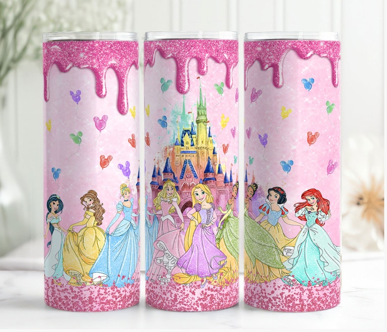 May include: A pink glitter tumbler with a pink and white dripping glaze design. The tumbler features a scene of Disney princesses in front of Cinderella's castle with Mickey Mouse balloons.