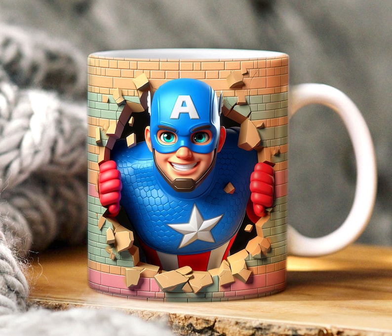 May include: A white ceramic mug with a handle features a colorful illustration of a superhero breaking through a brick wall. The superhero is wearing a blue, red, and white costume with a star on the chest and the letter "A" on the forehead.