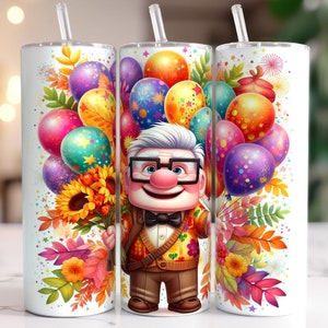 May include: A white tumbler featuring a colourful design with a cartoon character wearing glasses and a bow tie. The design includes balloons, flowers and leaves. The tumbler is ideal for holding drinks.