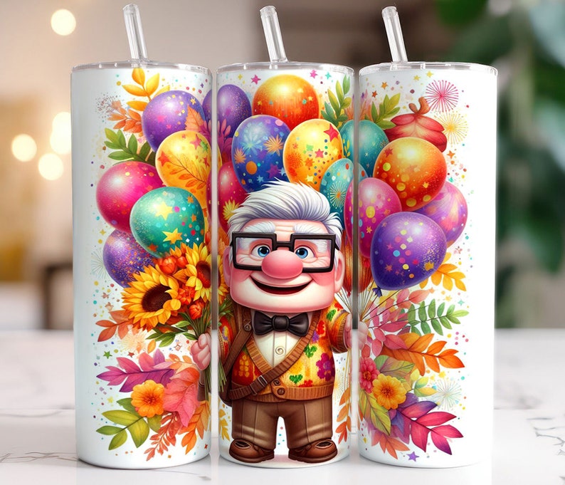 May include: A white tumbler featuring a colourful design with a cartoon character wearing glasses and a bow tie. The design includes balloons, flowers and leaves. The tumbler is ideal for holding drinks.