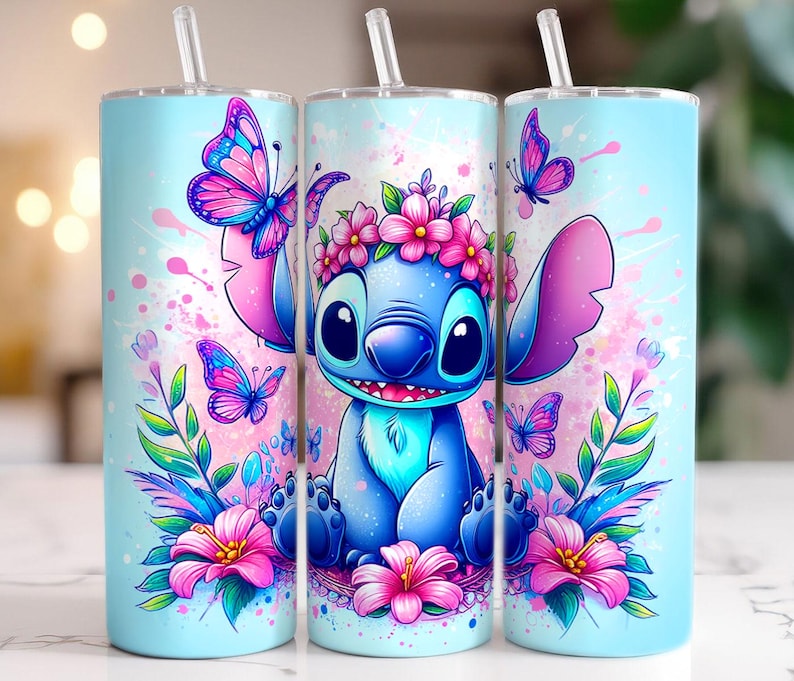 May include: A blue and pink stainless steel tumbler with a floral design and a cartoon Stitch character. The tumbler features a blue Stitch character with a flower crown, surrounded by pink flowers and butterflies.