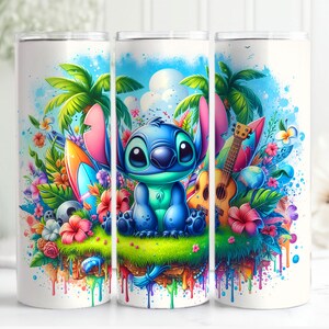 May include: A white tumbler with a colourful design featuring Stitch from Lilo & Stitch. The design includes a surfboard, a ukulele, tropical flowers, and palm trees. The background is a blue sky with white clouds.