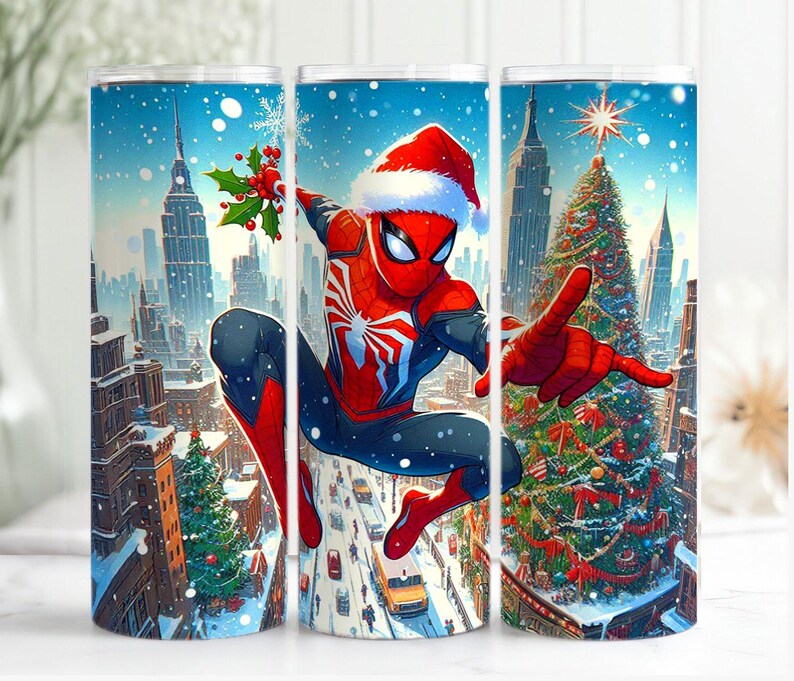 May include: A stainless steel tumbler with a festive design of Spider-Man in a Santa hat, set against a snowy cityscape with a Christmas tree. The artwork is vibrant with red, blue, and white colours, perfect for holiday gifting.