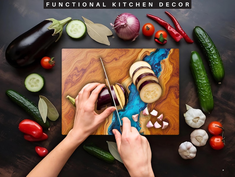 May include: A wooden cutting board with a blue and brown epoxy resin inlay. A person is using a knife to cut an eggplant on the board. There are also some garlic cloves and eggplant slices on the board.