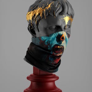 May include: A grey plaster bust of a man with gold paint dripping down his head. The bust is wearing a black bandana with a colourful graphic print of a zombie face.