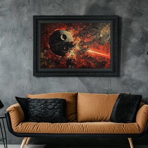 May include: A framed painting of a large, round, gray spaceship exploding in a fiery red and orange nebula. The spaceship has a small, round window in the center. The painting is set against a gray textured wall, with a brown couch and black lamp in the foreground.