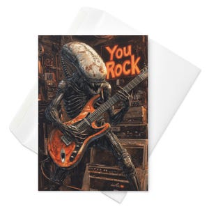 Xeno Shreds – Tarjeta divertida con la frase "You Rock", guitarrista alienígena xenomorfo, metalero de ciencia ficción, saludo musical épico