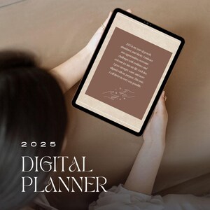 May include: A digital planner with the text "2025 DIGITAL PLANNER" on a brown background. The text on the screen reads "2025 is my year of growth, abundance, and clarity. I embrace new opportunities, overcome challenges with resilience, and welcome joy into my life. Each day, I grow stronger, wiser, and much more aligned with my purpose. This year, I will thrive in every way possible."