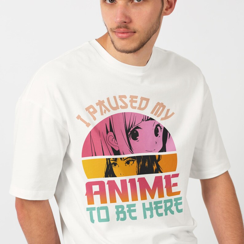 Close-up of anime graphic design on a  white t-shirt, worn by a male model.