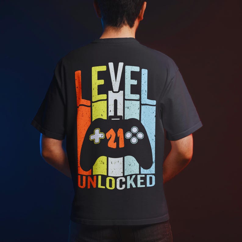 Backside view of a T-shirt mockup featuring a game controller and typography