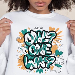 May include: White sweatshirt with a green and orange graphic print that says "Only One Way".