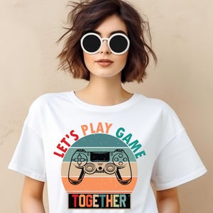 Female model showcasing a gaming T-shirt with a retro themed bold and trendy design, ideal for video game lovers and casual wear.