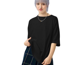 May include: A black oversized t-shirt with a silver chain necklace with a small charm that says "Boss".