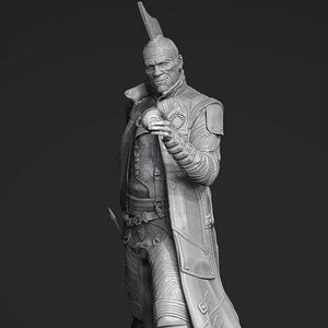 May include: A detailed gray 3D printed model of a character wearing a long coat and holding a small orb. The character has a mohawk and a weathered face.