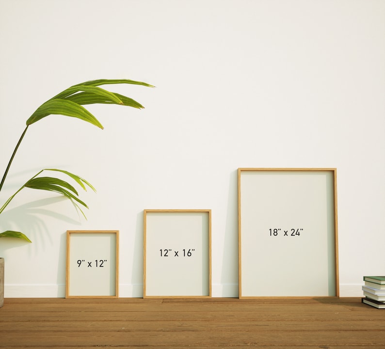 May include: Three framed art prints of varying sizes: 9 x 12 inches, 12 x 16 inches, and 18 x 24 inches. Each print has a light-colored interior and a natural wood frame. The frames are displayed on a wooden floor against a white wall.