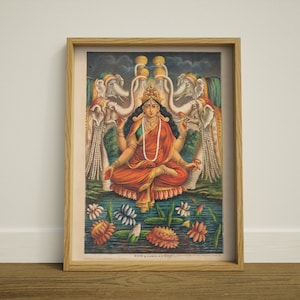 May include: A vintage illustration of a Hindu goddess sitting in a lotus position with four arms. She is adorned with jewelry and a red sari. She is surrounded by white elephants with their trunks raised. The background is a blue and green landscape with lotus flowers.