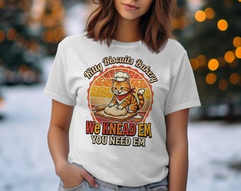 Maglietta Kitty Biscuits Bakery, maglietta divertente con gatto fornaio, maglietta retrò con gioco di parole "We Knead Em You Need Em", regalo per amanti dei gatti