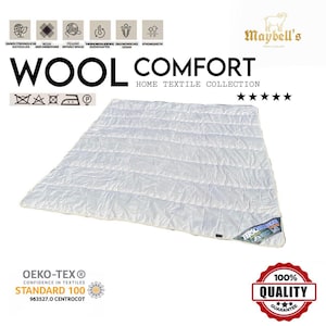 Può includere: Trapunta in lana bianca con un design trapuntato. La trapunta ha un'etichetta che dice "Terschelling" ed è certificata Oeko-Tex Standard 100. La trapunta fa parte della collezione "Wool Comfort Home Textile Collection" di Maybell's.