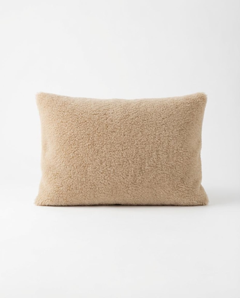 May include: A set of three ceramic mugs with a speckled, matte finish. Each mug features a different color: light blue, cream, and gray. The mugs have a simple, modern design and a comfortable handle.