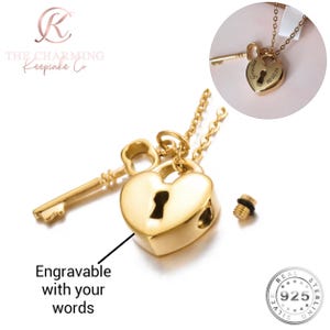 May include: A gold-coloured heart-shaped pendant with a key and chain. The pendant has a keyhole design and the text "Engravable with your words". A smaller heart pendant with the word "Grandad" and the date "02.03.24" is also shown.