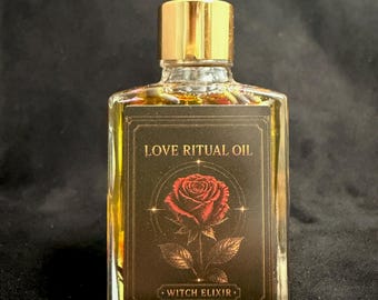 May include: A rectangular glass bottle filled with golden oil and dried botanicals, featuring a black dropper cap with a gold collar. The front label is black with gold text reading LOVE RITUAL OIL and WITCH ELIXIR, centered by a detailed red rose illustration.