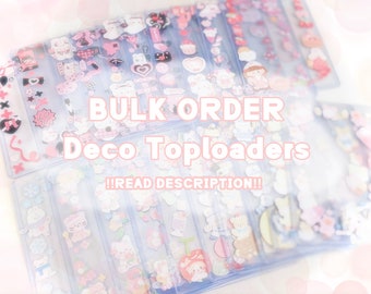 May include: A bulk order of clear plastic top loaders filled with colourful, pink, and white decorative stickers. The text "BULK ORDER Deco Toploaders!! READ DESCRIPTION!!" is printed on the top of the image.