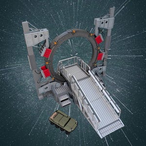 May include: A detailed model of a Stargate, featuring a large circular gate with red and grey accents, a ramp, and a small green vehicle. The model is set against a dark background with a starburst effect.