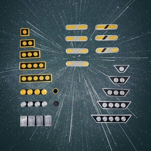 May include: A collection of rank insignia pins featuring various rectangular and trapezoidal shapes. The set includes yellow and black bars with circular accents, silver and black trapezoids with circular details, and individual metallic circular pins.